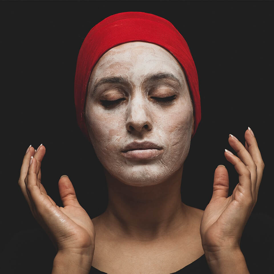 woman with clay mask